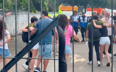 Familiares e amigos das vítimas choram em local de queda de helicópteros, no Rio de Janeiro